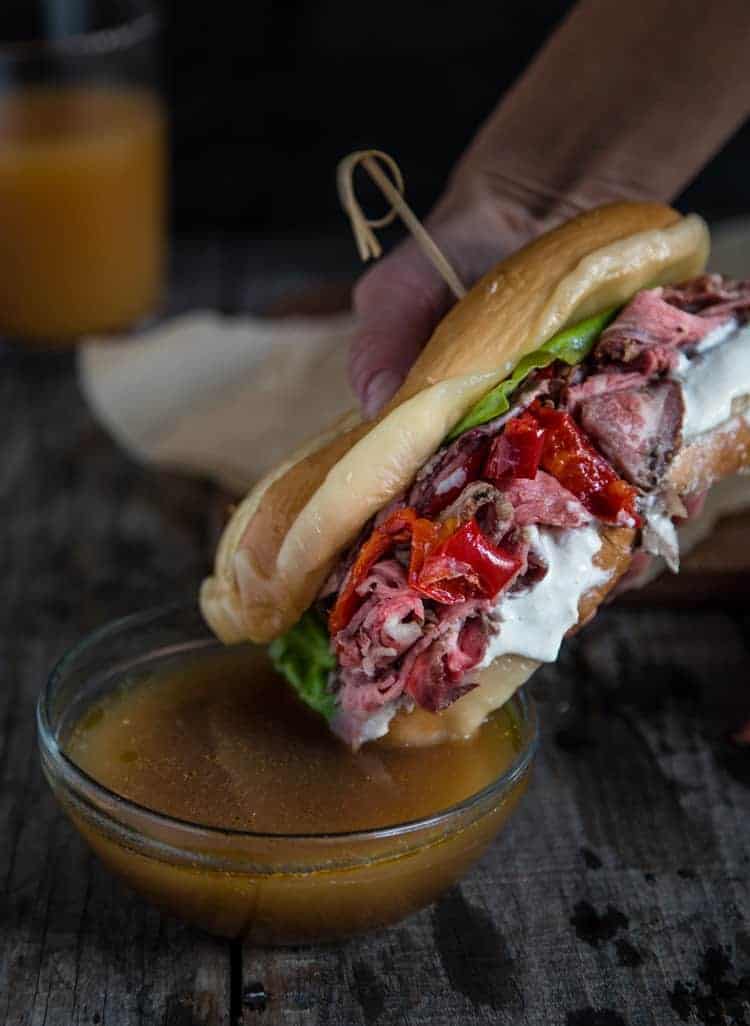 Dunking a French Dip Sandwich into homemade Au Jus