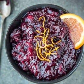 Homemade cranberry sauce with orange zest garnish