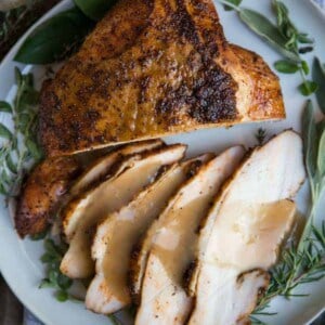 Maple glazed turkey sliced on a plate.