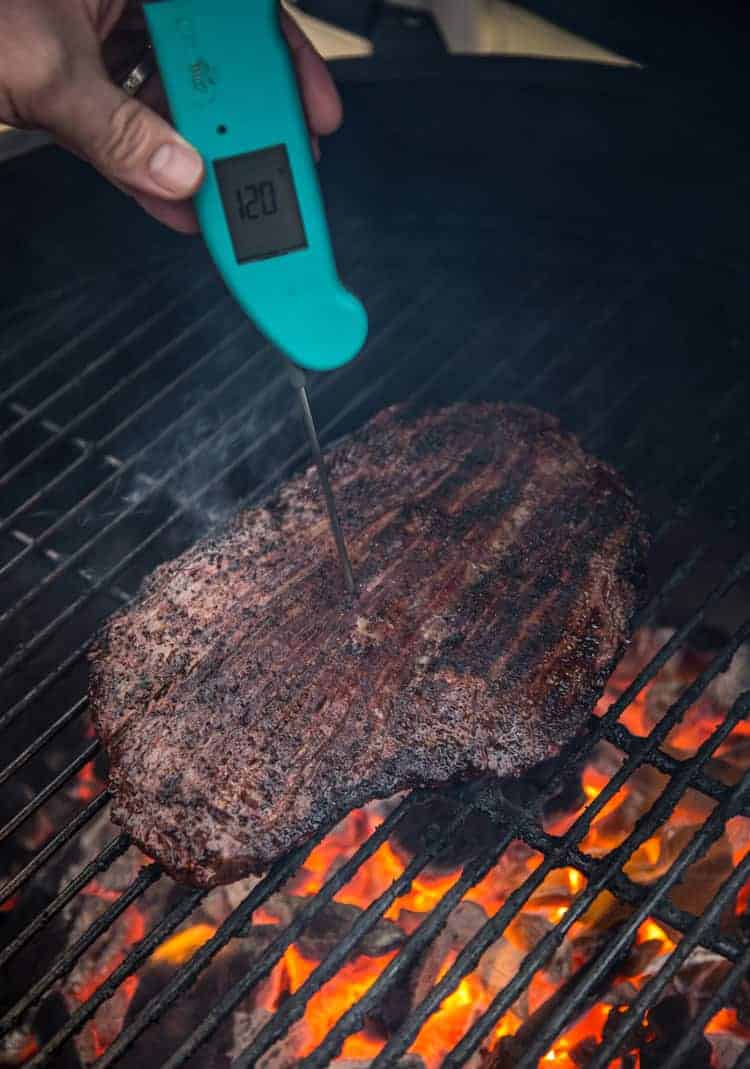 Taking temperature of a steak with a Thermoworks Thermapen digital thermometer