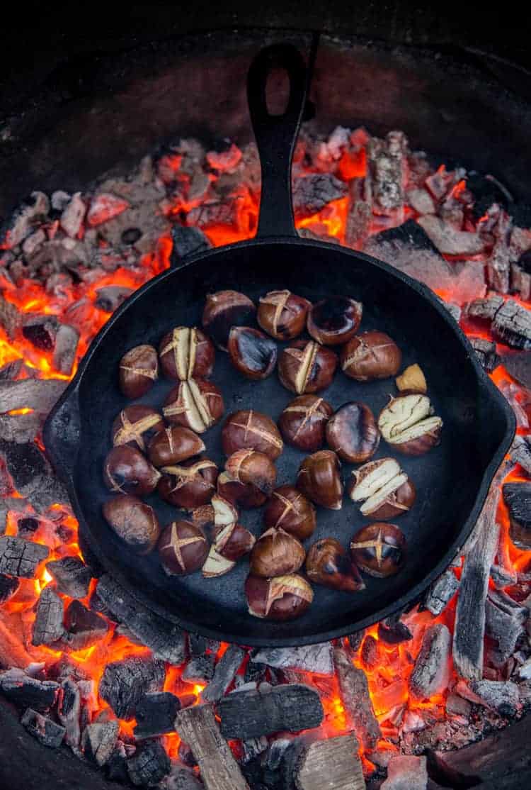 Roasting Chestnuts on an open fire in a cast iron pan