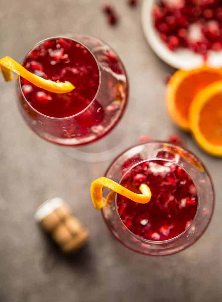 A top down look at two Pomegranate  Champagne cocktails