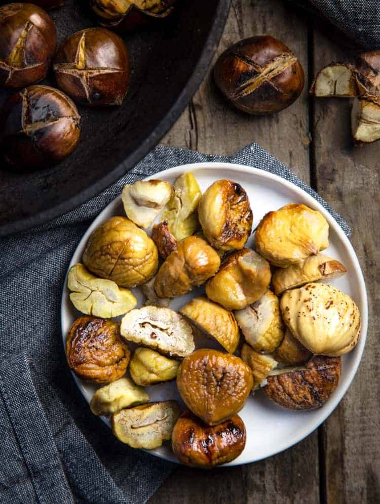 Roasted Chestnuts shelled and served on a white plate