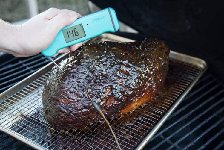 Taking the temperature of a ham using a Thermoworks Thermapen, instant read thermometer