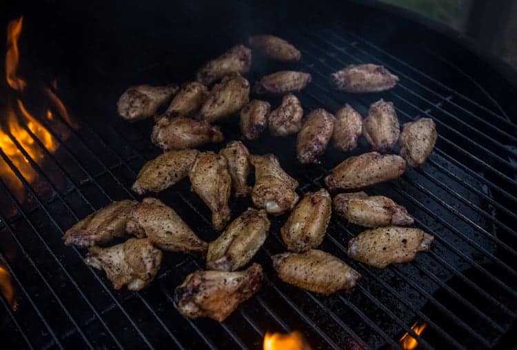 Smoked chicken wings on the grill grate.