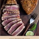 Grilled Tuna Steak on a cutting board with slices of perfectly cooked Ahi Tuna