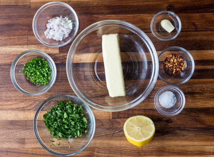 Ingredients for herb compound butter on a cutting board