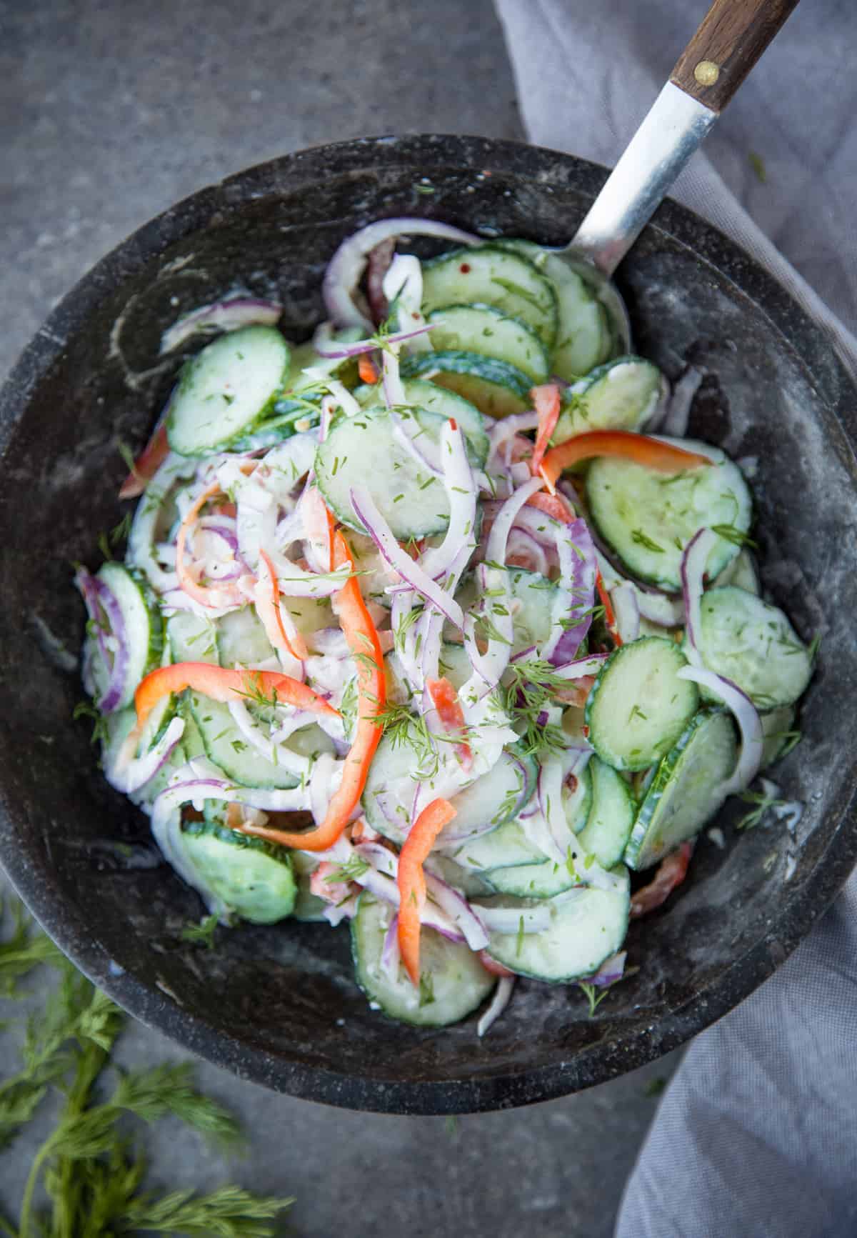Fresh and creamy cucumber salad with dill and white wine vinegar