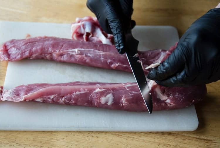 showing how to trim a pork tenderloin