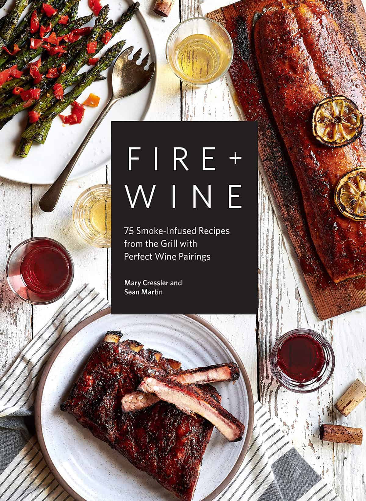 Fire and Wine Cookbook cover photo featuring cedar plank salmon, ribs, and asparagus with spicy peppers.