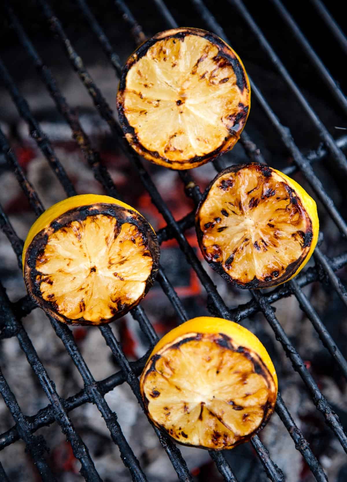 Grilled Lemons on grill grates.