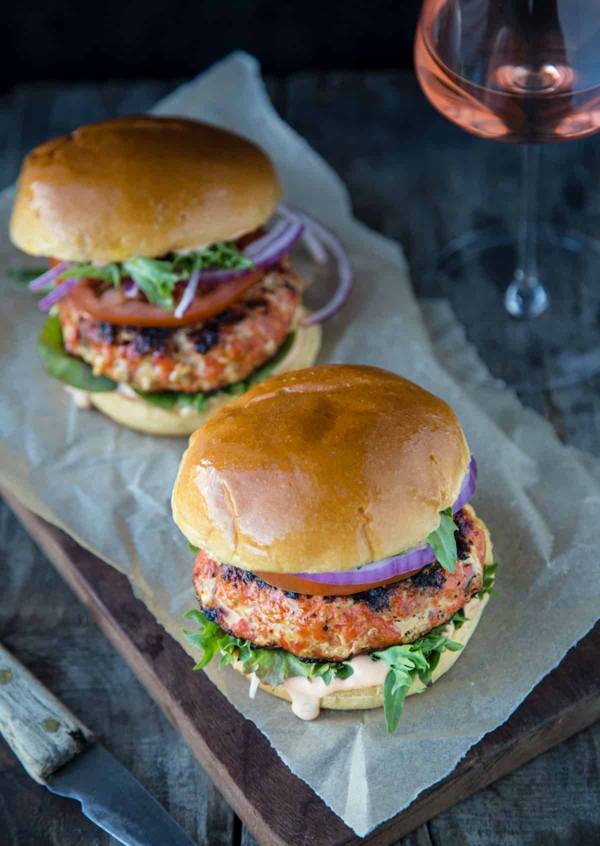 Salmon Burgers with a glass of wine to pair