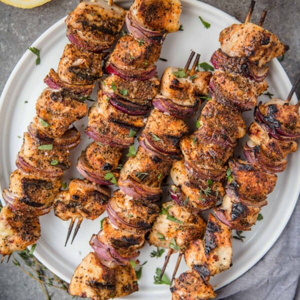 grilled chicken skewers on a plate.