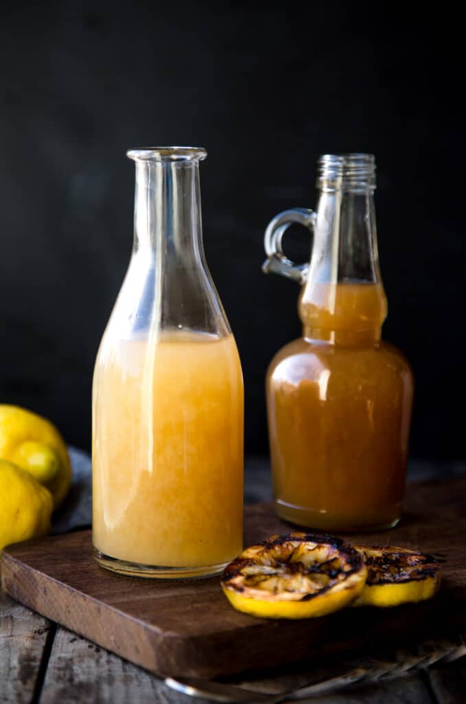 Two bottles of grilled lemon simple syrup