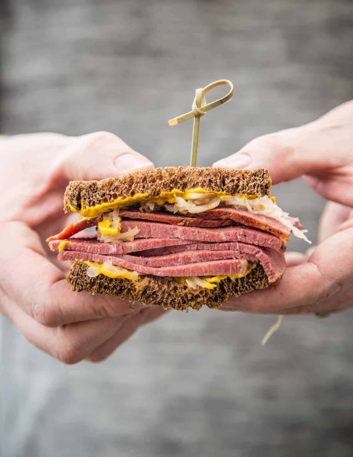 Holing a Smoked Corned Beef Sandwich