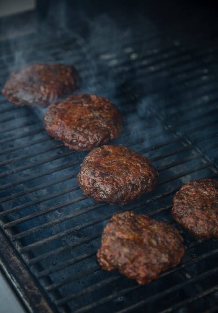 Burgers Being Grilled Over High Heat