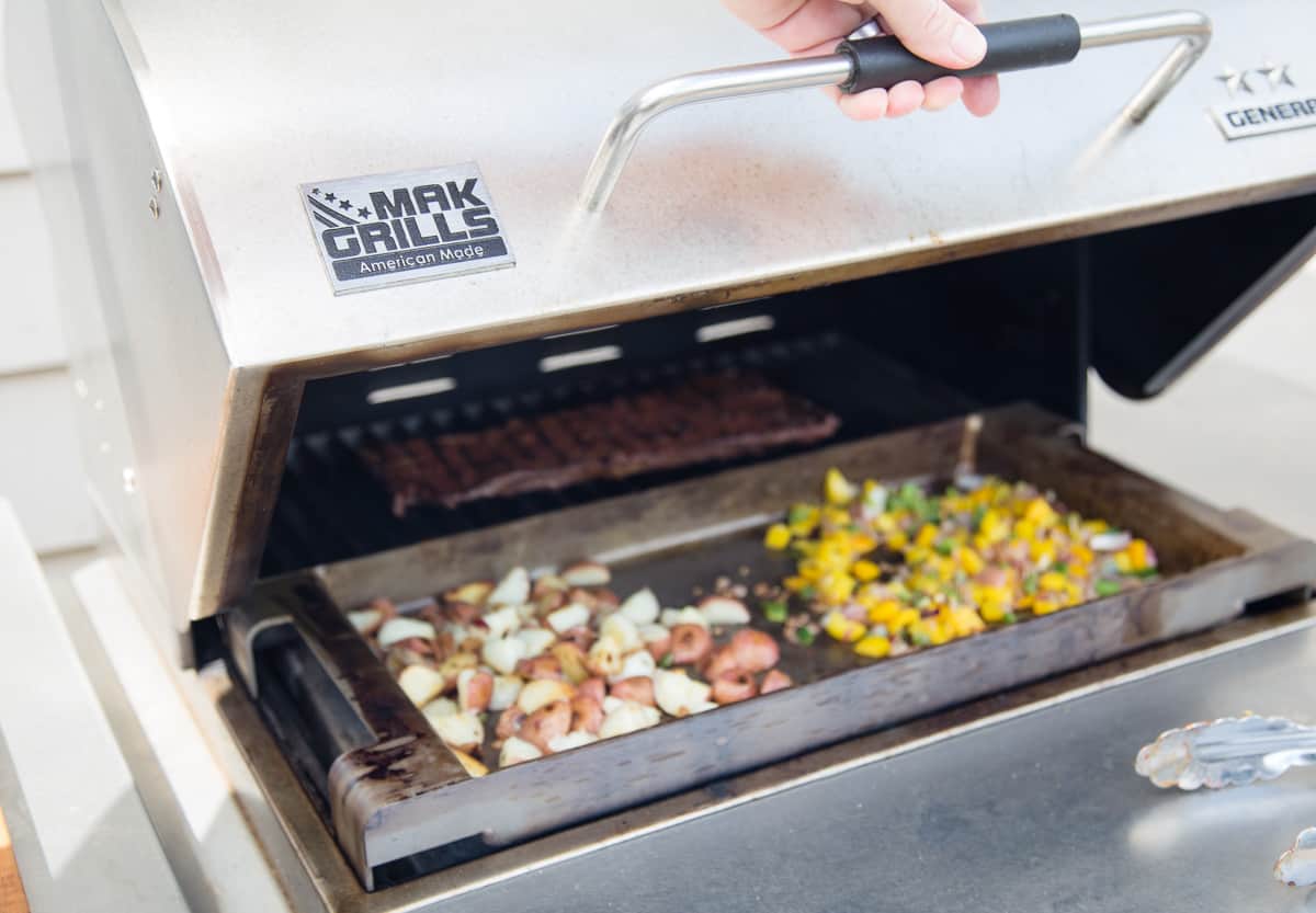 Ingredients for a breakfast burrito being cooked on a MAK grills pellet grill