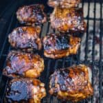 Chicken Thighs being cooked over indirect heat on a Big Green Egg grill