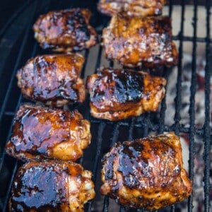 Chicken Thighs being cooked over indirect heat on a Big Green Egg grill