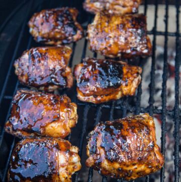 Chicken Thighs being cooked over indirect heat on a Big Green Egg grill