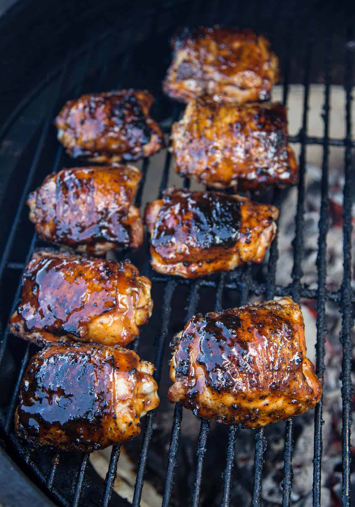 Chicken Thighs being cooked over indirect heat on a Big Green Egg grill