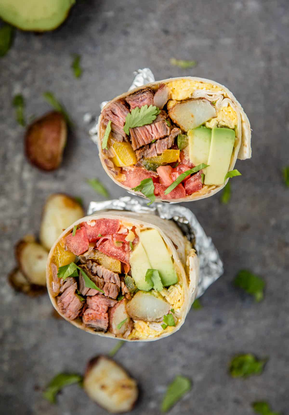 A Steak and Egg Breakfast Burrito cut in half