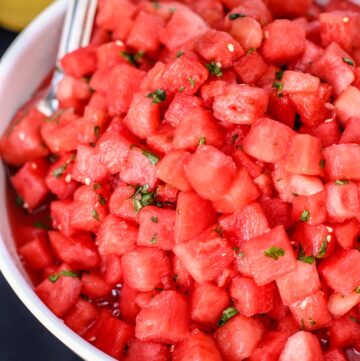 Watermelon Salad with Basil and White Balsamic Vinegar in a white bowl