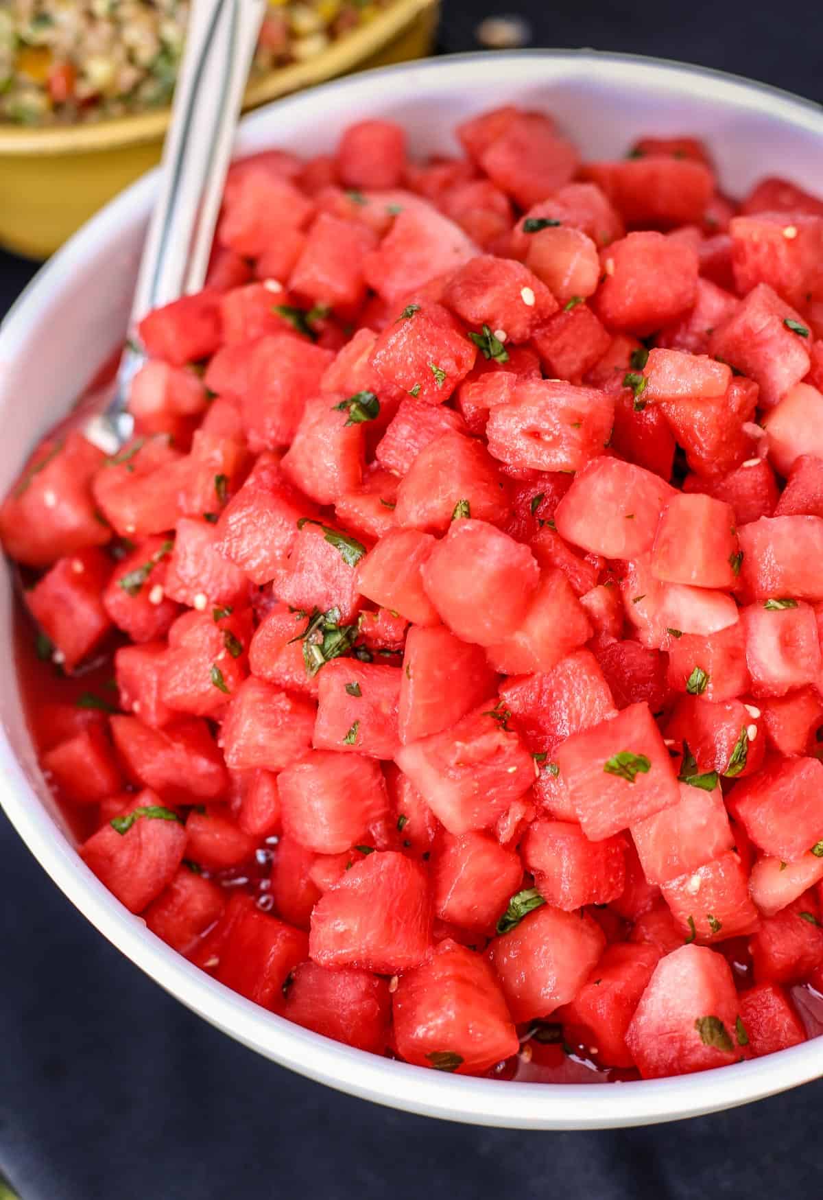 Watermelon Salad with Basil and White Balsamic Vinegar in a white bowl