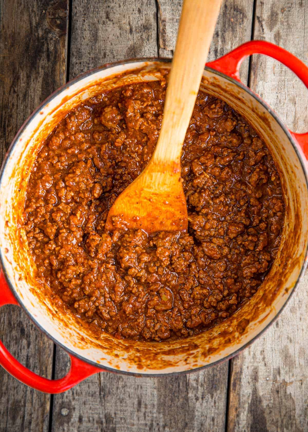 A large cast iron pot filled with ground beef chili