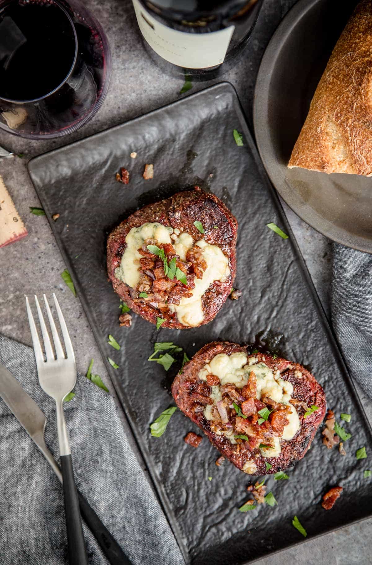 2 Grilled Filet Mignons and a glass of Cabernet Sauvignon red wine