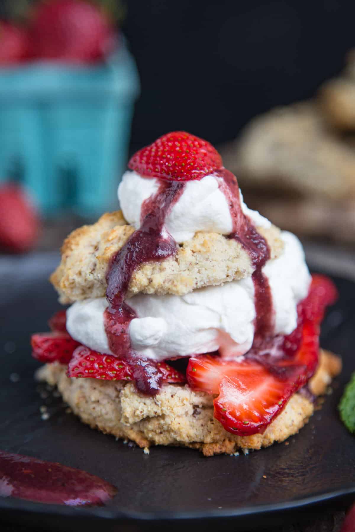 Smoked Strawberry Shortcake on a biscuit topped with whipped cream and smoked strawberry jam