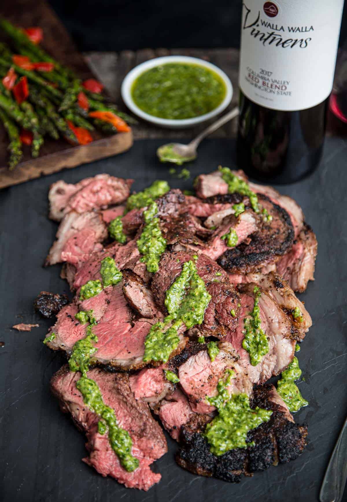 Grilled Steak slices with a bottle of wine