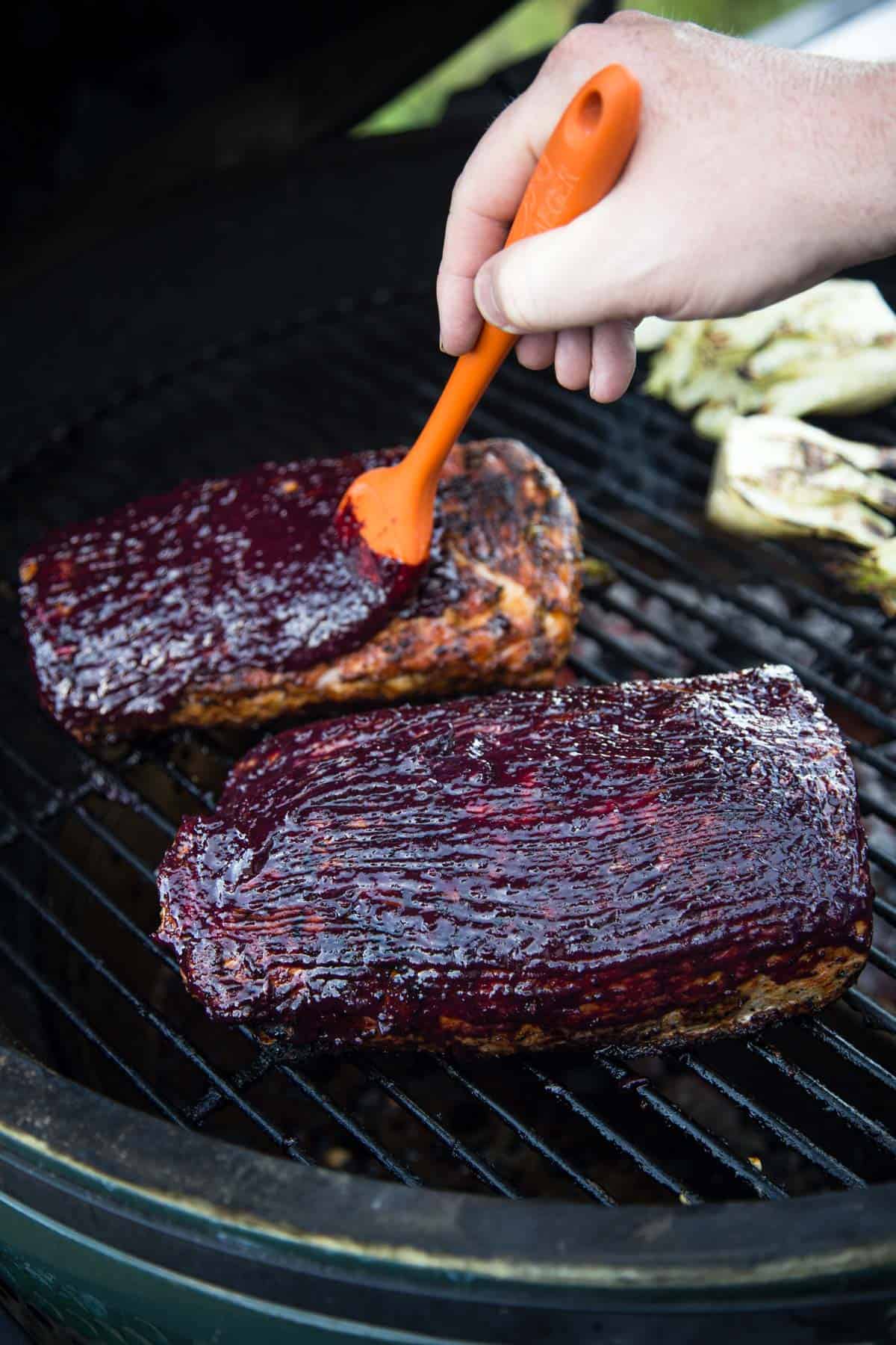 Applying a wine glaze to a pork loin