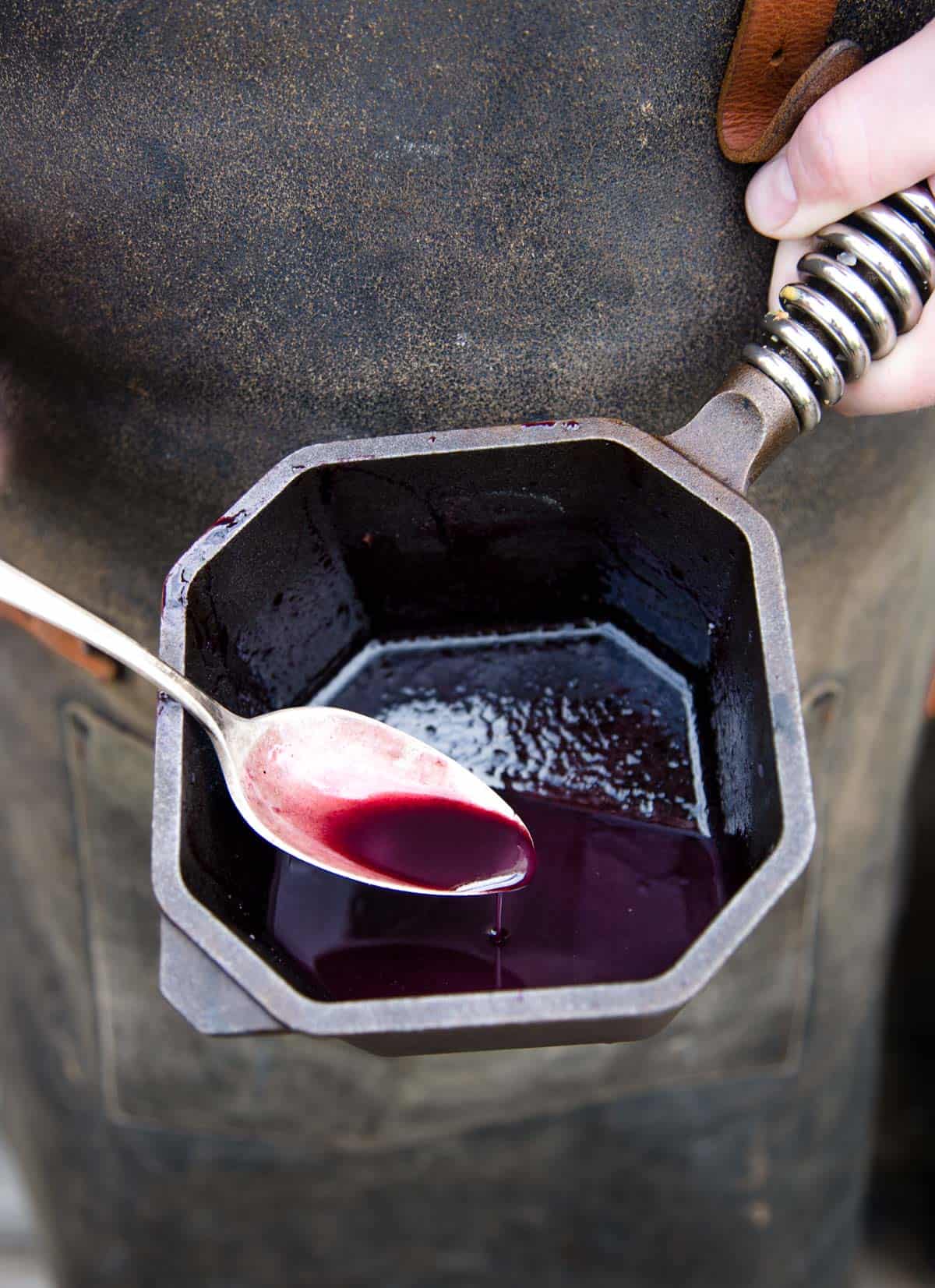 Pinot Noir wine and Marionberry reduction sauce in a small saucepan