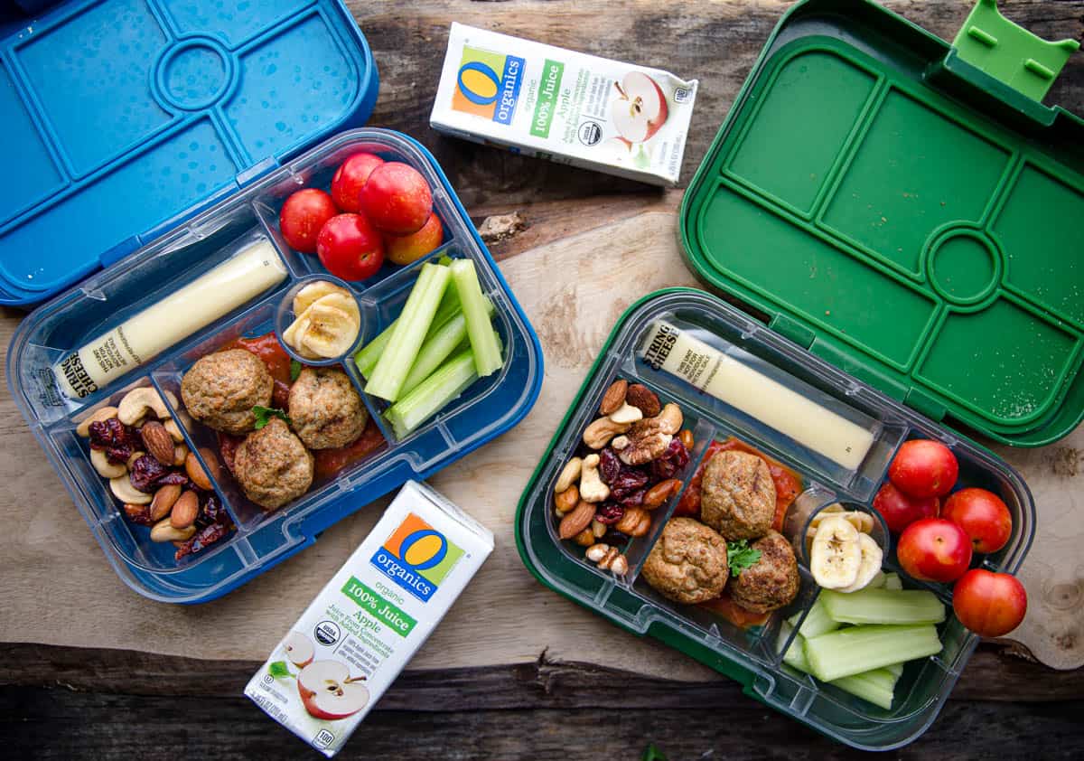 Two bento boxes filled with school lunch ideas. 