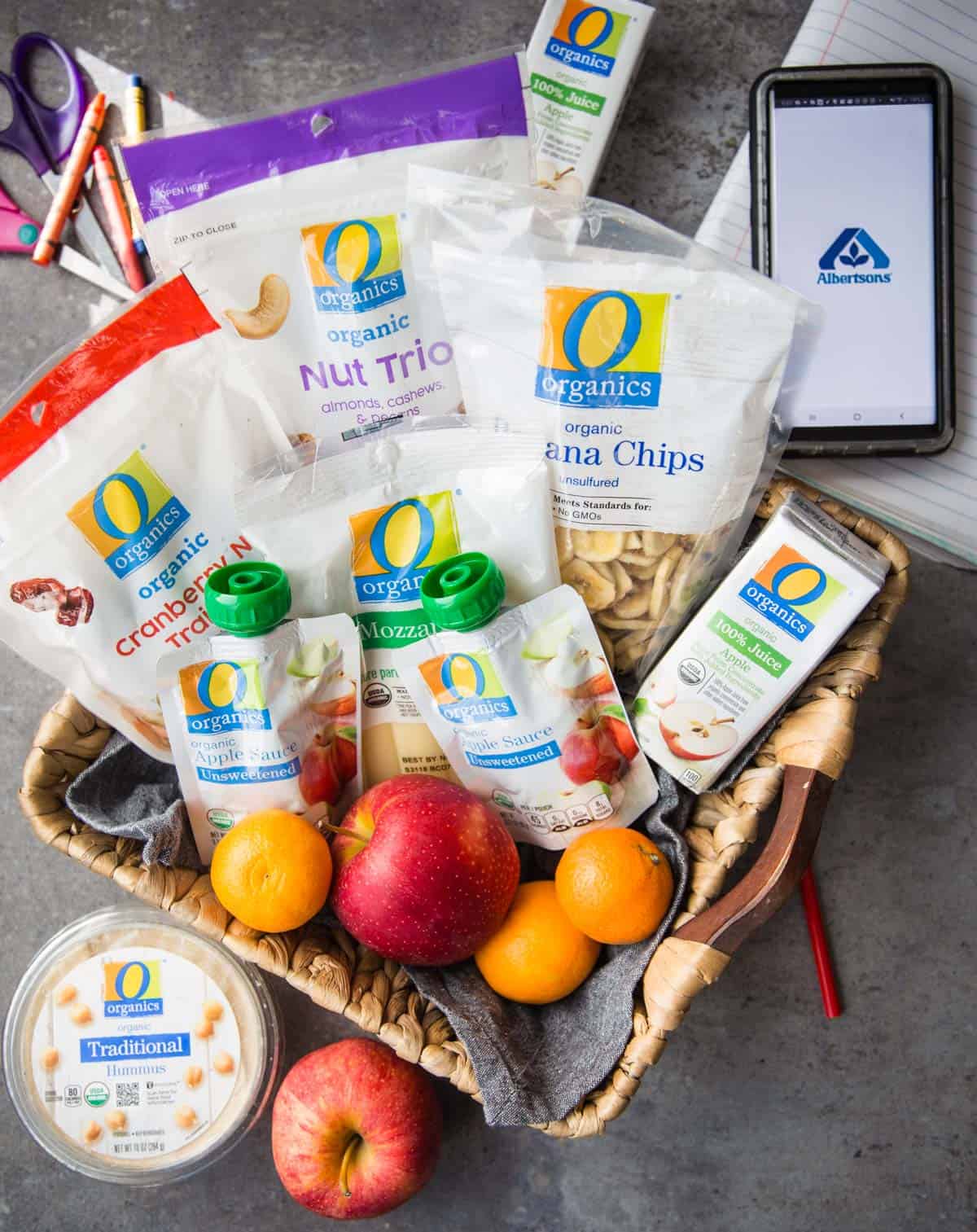 A basket full of O Organics snacks.