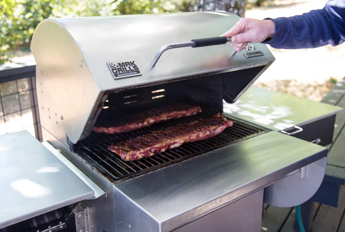 MAK Two Star General Pellet Grill with Ribs cooking on it