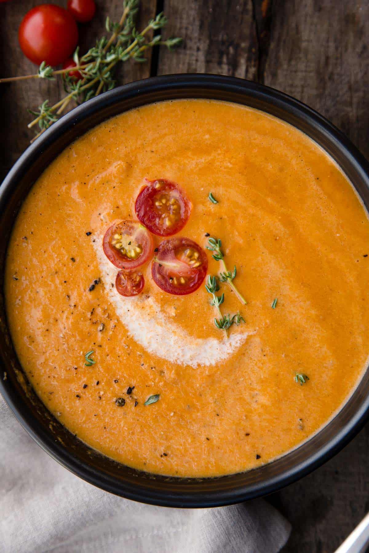 A closeup of a bowl of smoked tomato bisque