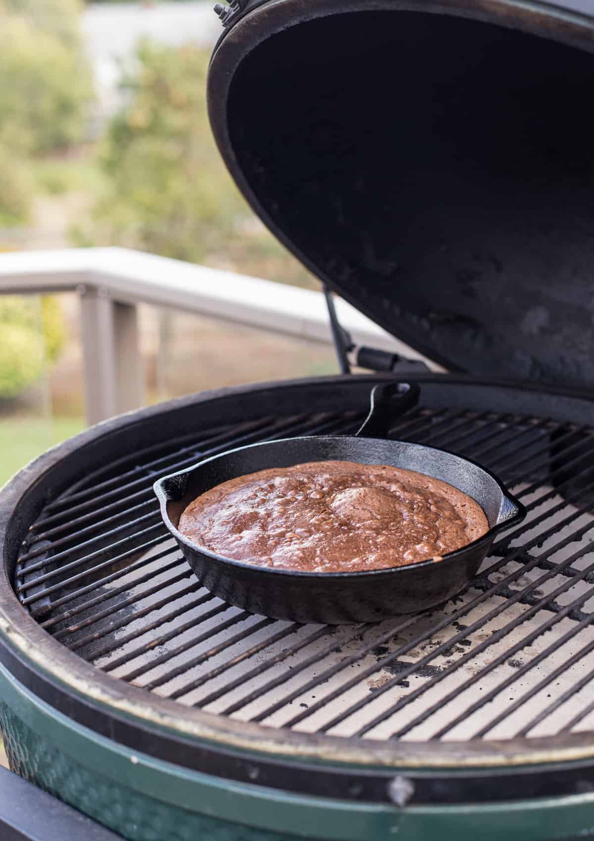 Cast Iron Pan full of brownies cooking on a Big Green Egg grill