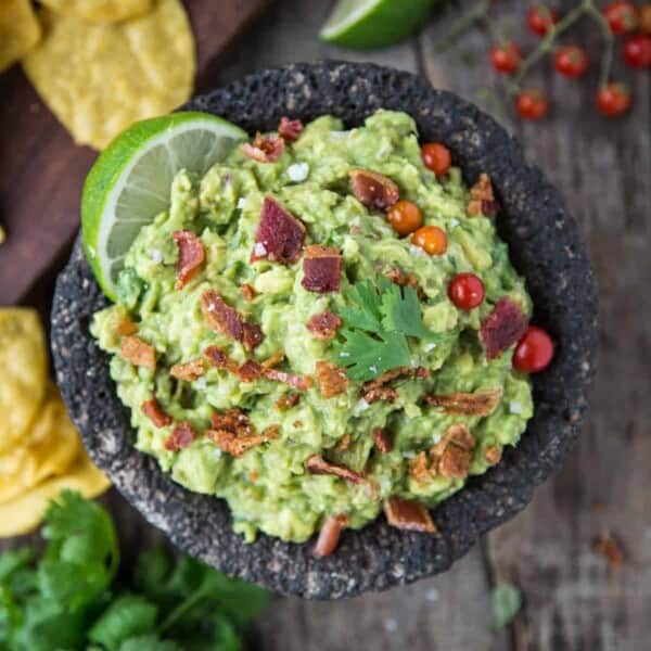 Smoked bacon and tomatillo guacamole with chips.