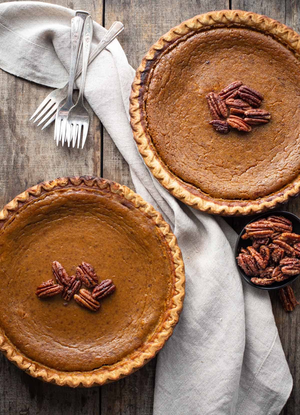 Two grilled pumpkin pies resting before serving