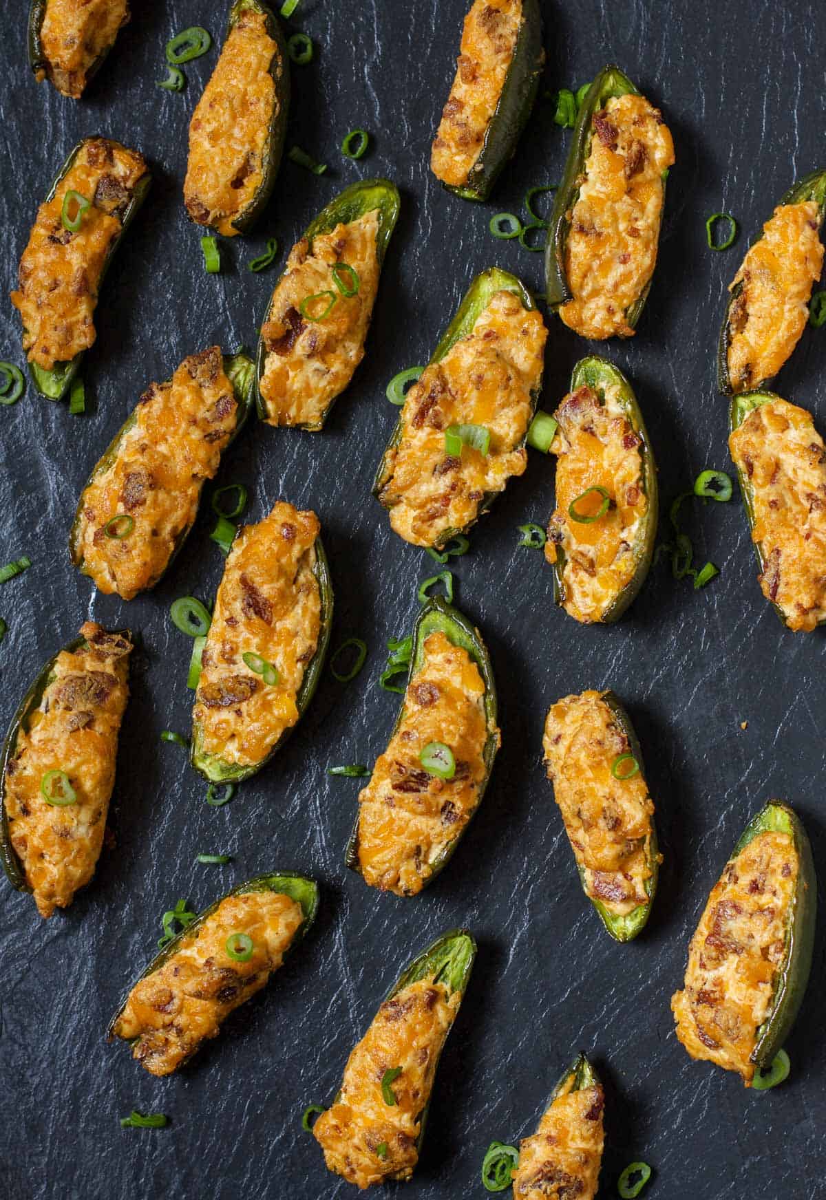 Smoked Jalapeño Poppers on a black slate platter