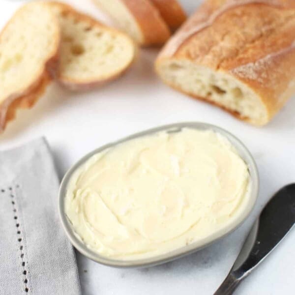 smoked honey butter with bread in a dish.