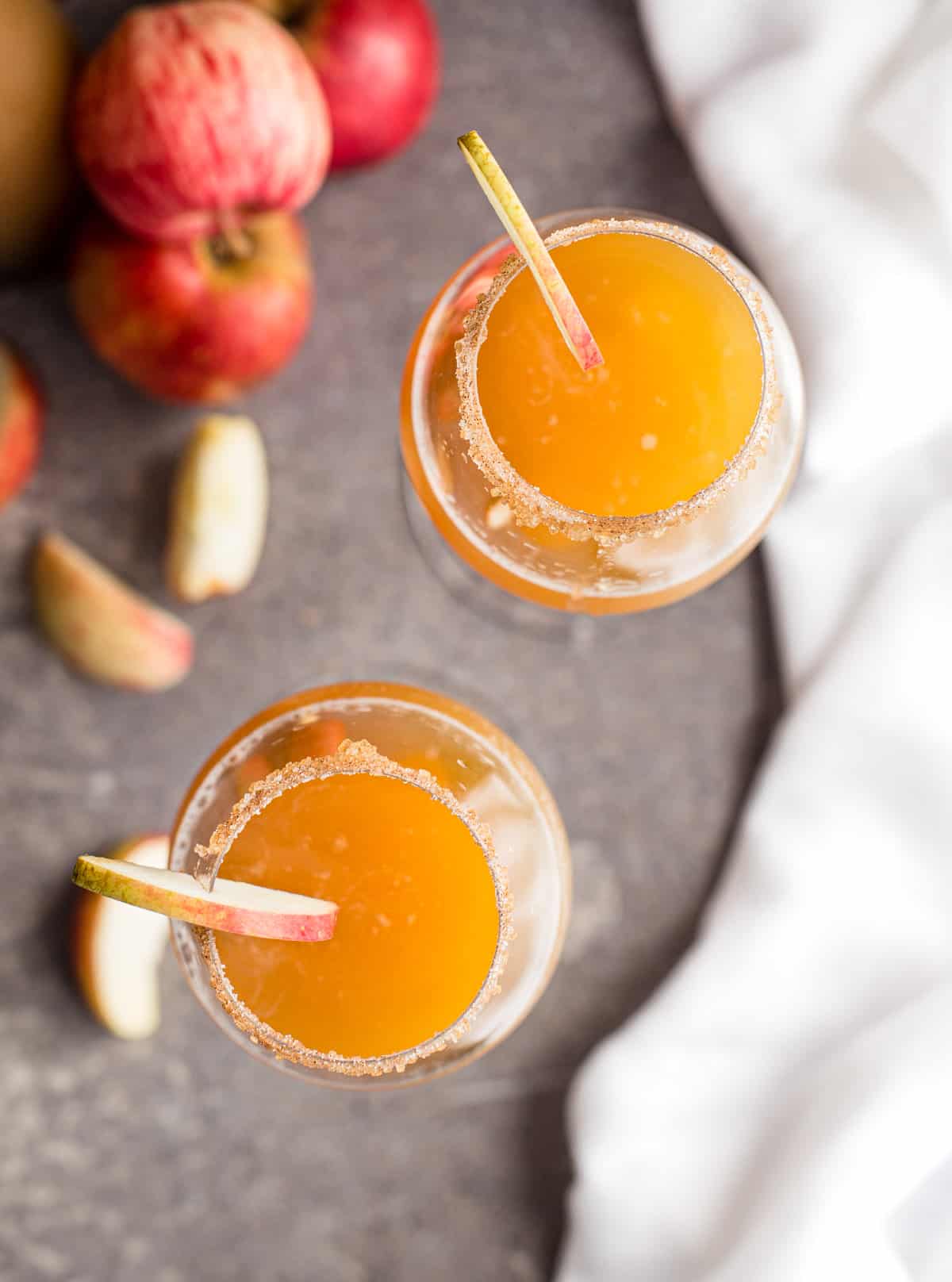 A top down shot of two apple cider mimiosas