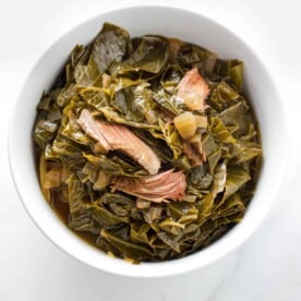 collard greens with smoked turkey in a white bowl