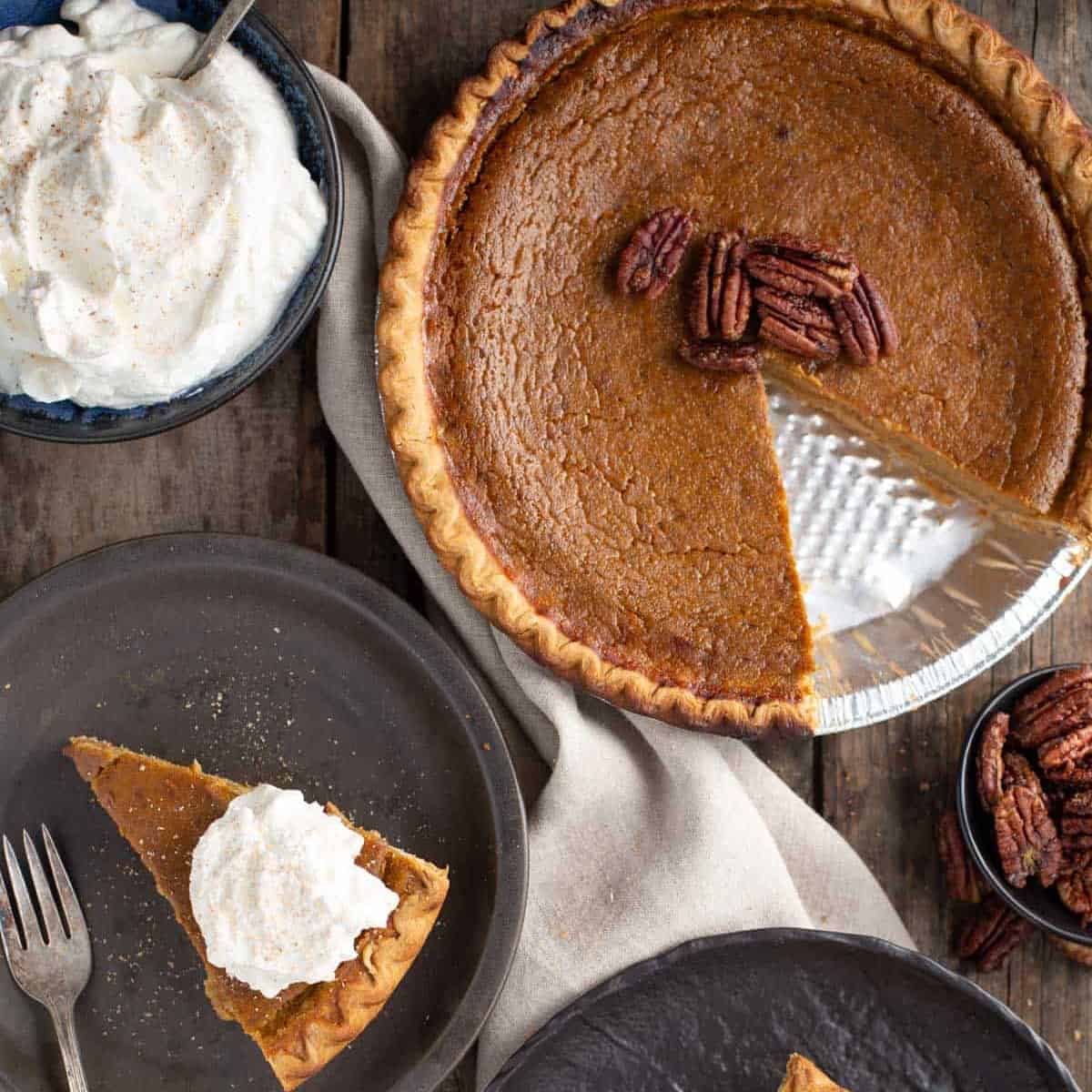 Grilled pumpkin pie and slice with whipped cream.