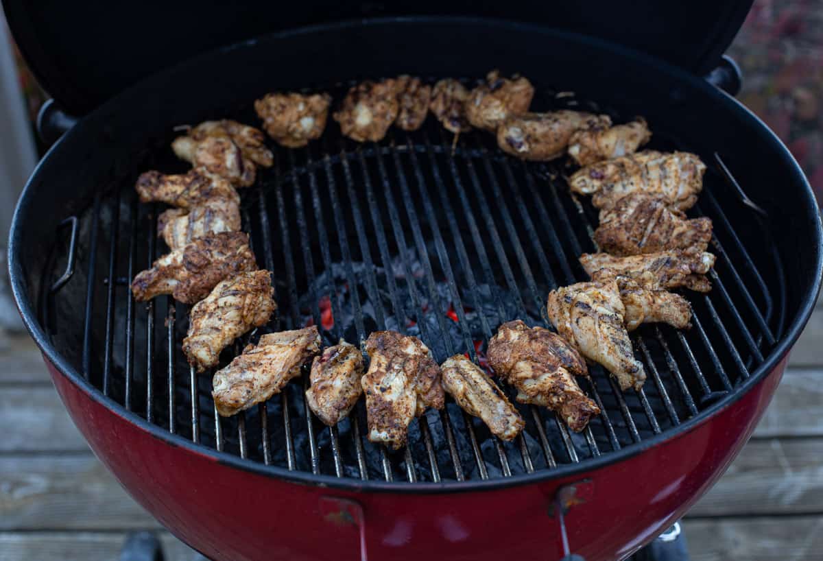 Chicken wings cooking on the grill