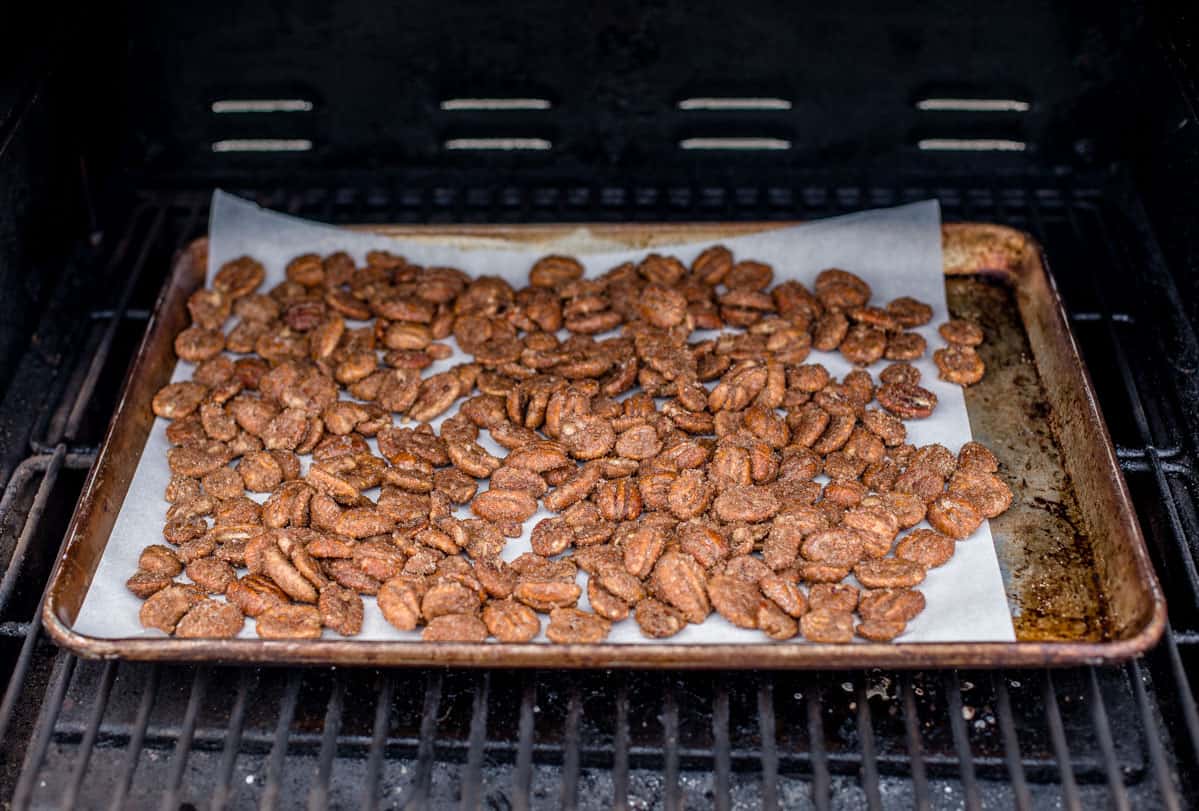 A tray with smoked candied nuts on the grill