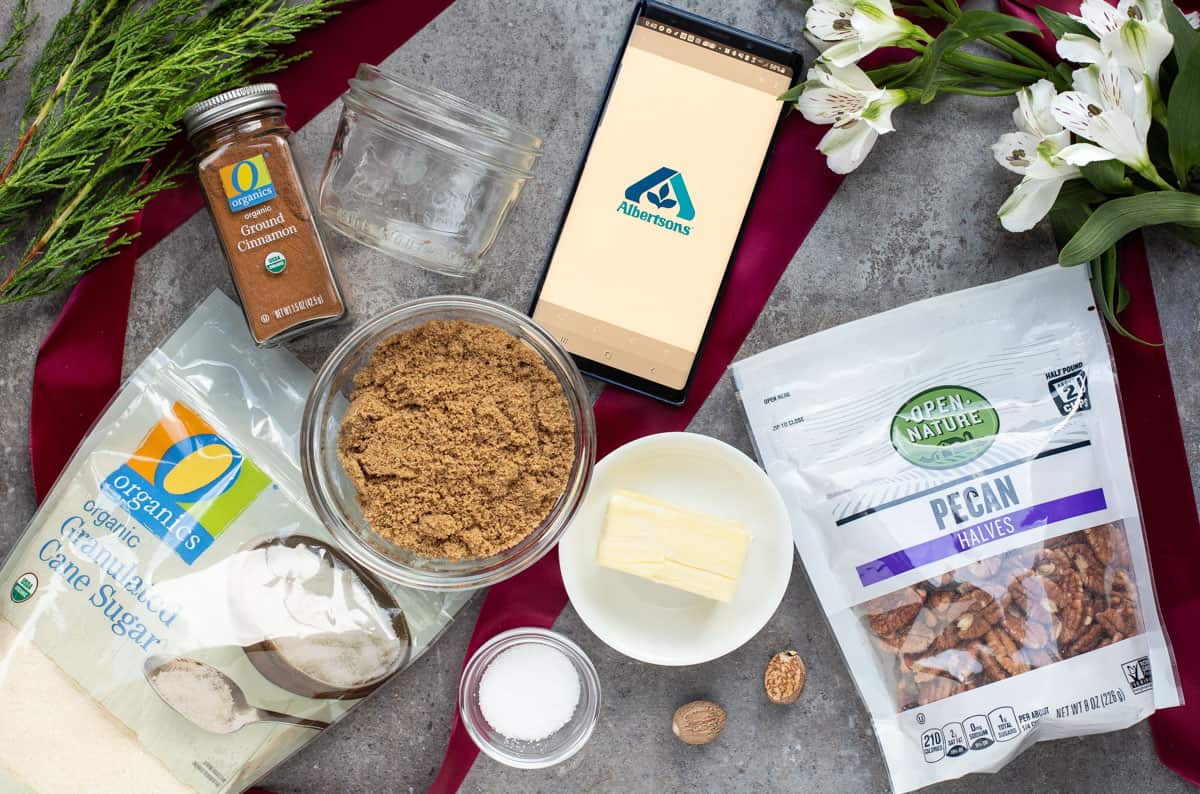 Ingredients for smoked candied pecans laid out on a board