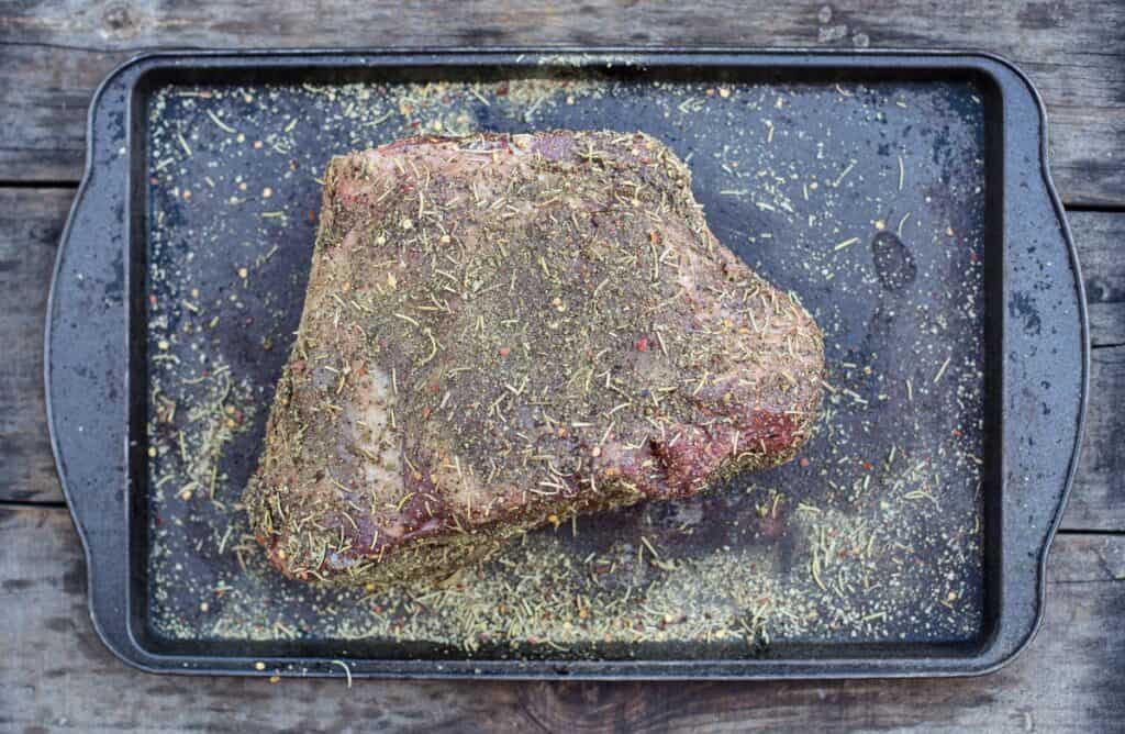 raw leg of lamb seasoned